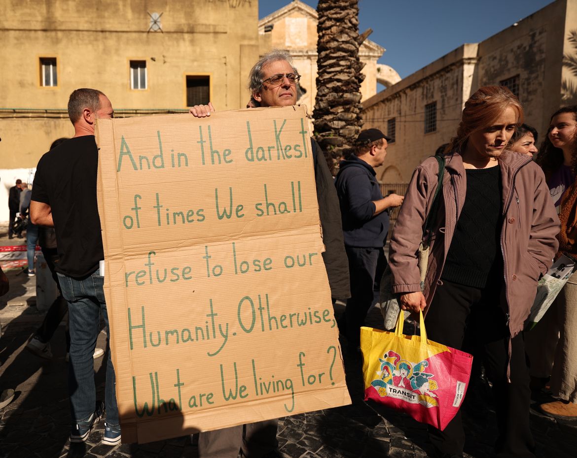 Israeli Arab and Jewish peace activists take part in a protest demanding an end to the war and the exchange of prisoners and hostages between Hamas and Israel in the coastal city of Haifa, north of Israel, 20 January 2024