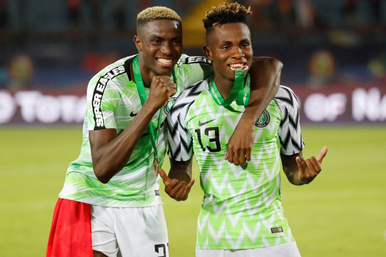 Nigeria's Victor Osimhen and Samuel Chukwueze celebrate after winning the Third Place Play Off