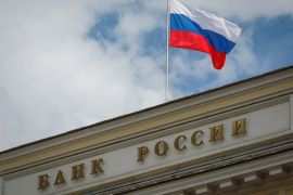 A Russian state flag flies over the Central Bank headquarters in Moscow on August 15, 2023 [File: Reuters/Shamil Zhumatov]