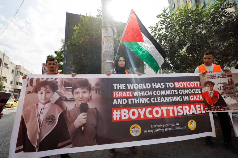 Palestinians call to boycott Israeli products during a protest in support of the people of Gaza, as the conflict between Israel and Palestinian Islamist group Hamas continues, in Hebron, in the Israeli-occupied West Bank, October 28, 2023