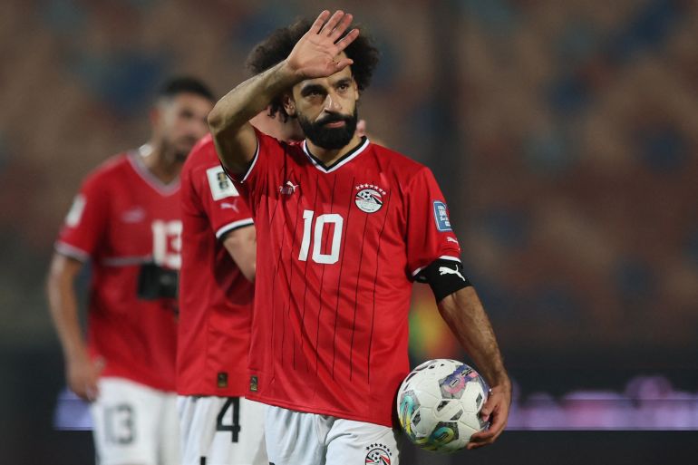 Soccer Football - World Cup - CAF Qualifiers - Group A - Egypt v Djibouti - Cairo International Stadium, Cairo, Egypt - November 16, 2023 Egypt's Mohamed Salah celebrates with a match ball after the match after scoring four goals REUTERS/Amr Abdallah Dalsh