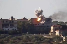 Smoke and fire rise from a building following an Israeli strike on what the Israeli military says are Hezbollah targets in a location given as Lebanon, amid the ongoing cross-border hostilities between Hezbollah and Israeli forces, in this screengrab taken from an undated handout video released on November 24, 2023.