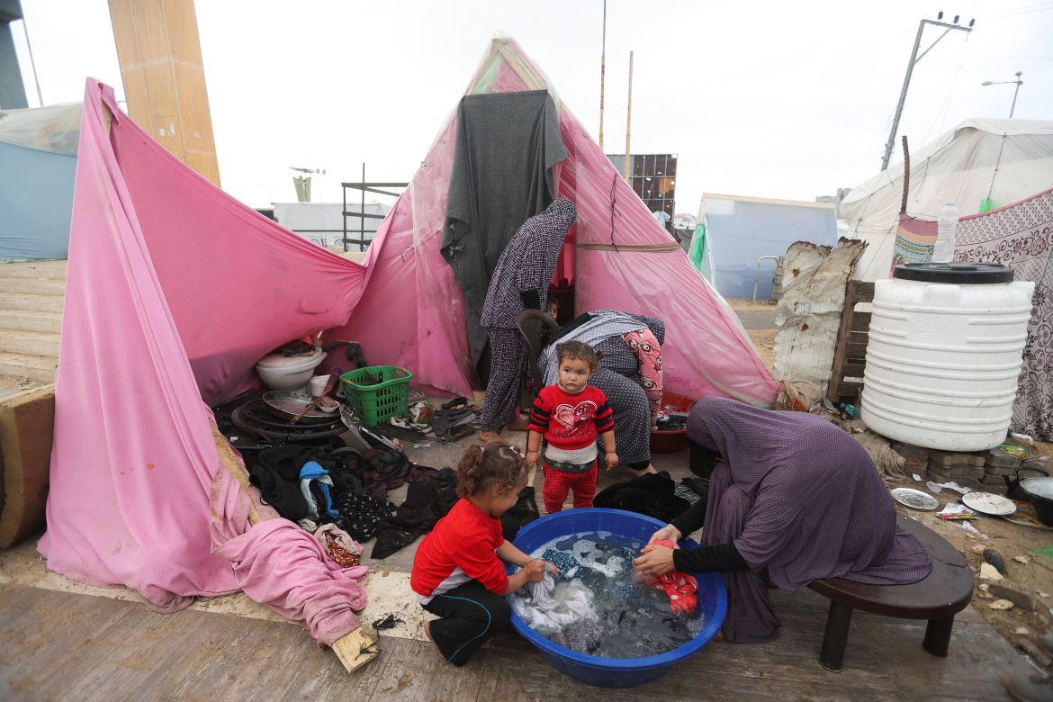 Displaced Palestinians, who fled their houses due to Israeli strikes, shelter in a tent camp, amid the ongoing conflict between Israel and the Palestinian Islamist group Hamas, in Rafah in the southern Gaza Strip, December 25