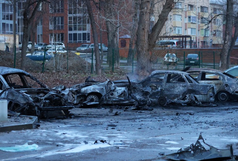 A view shows burned out cars