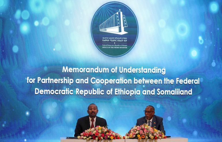 Somaliland President Muse Bihi Abdi and Ethiopia’s Prime Minister Abiy Ahmed attend the signing of the Memorandum of Understanding agreement, that allows Ethiopia to use a Somaliland port, in Addis Ababa, Ethiopia, January 1, 2024. REUTERS/Tiksa Negeri