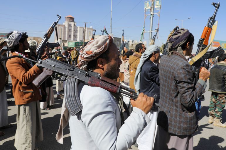 Newly recruited Houthi fighters hold up firearms during a ceremony at the end of their training in Sanaa, Yemen January 11, 2024. REUTERS/Khaled Abdullah
