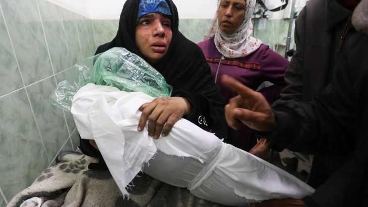 Palestinian Doaa Abu Lashin reacts on seeing her daughter Zeinab Abu Lashin, who was killed in an Israeli attack