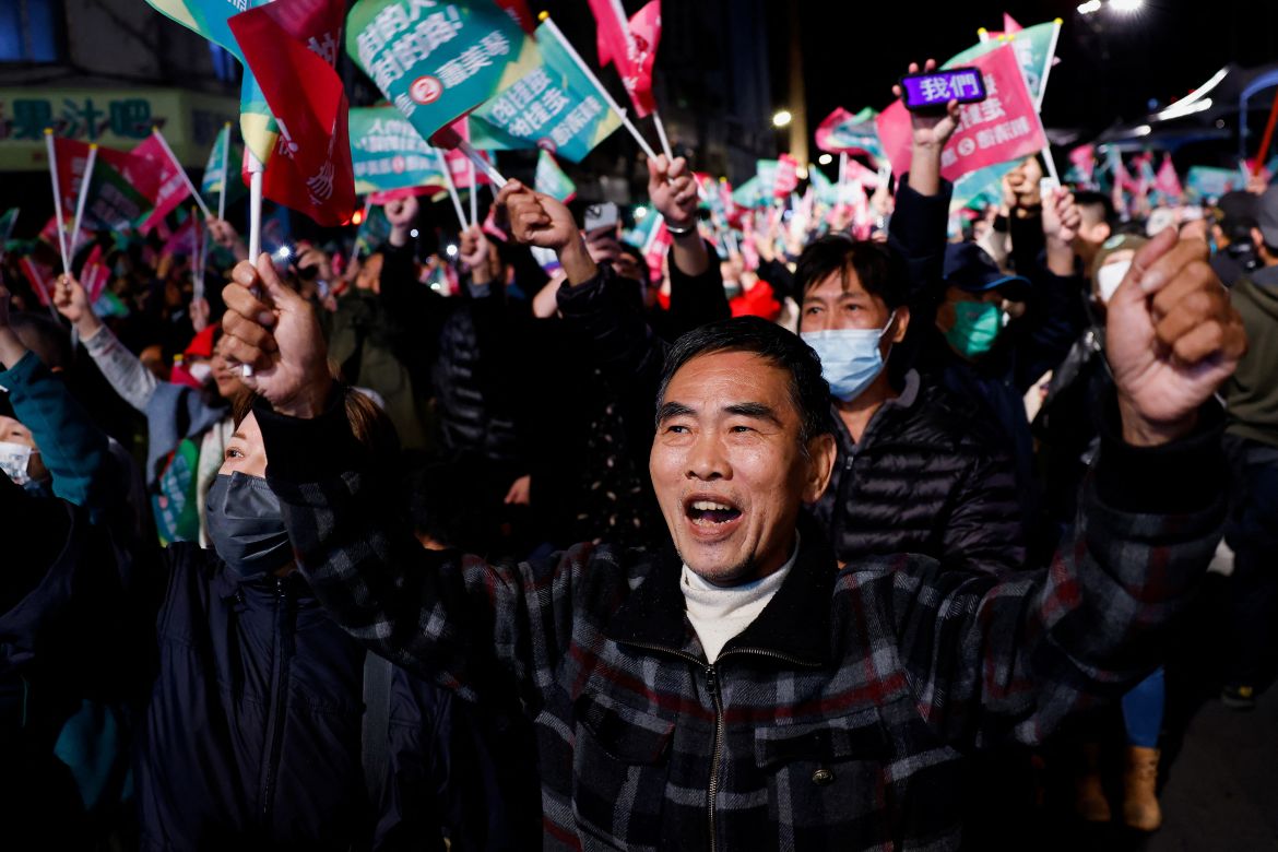 Supporters of the Democratic Progressive Party (DPP) react, while they gather near the DPP party headquarters, as they wait for preliminary results of the presidential and parliamentary elections, in Taipei, Taiwan January 13