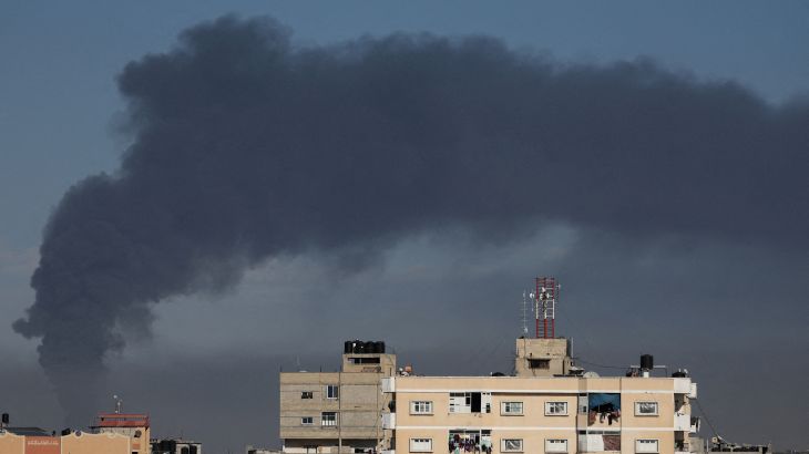 Smoke rises amid Gaza buildings
