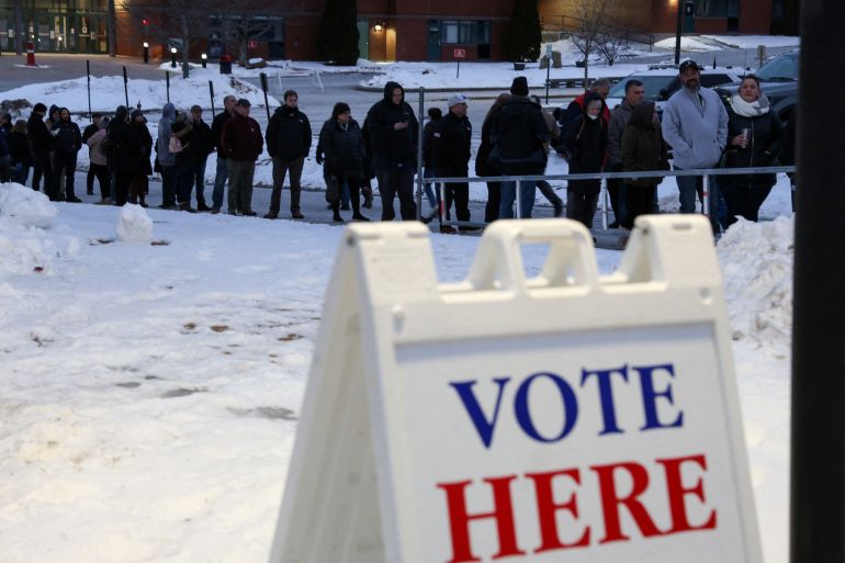 People line up to vote during the 2024 Republican presidential primary, at Pinkerton Academy in Derry, New Hampshire, U.S., January 23, 2024