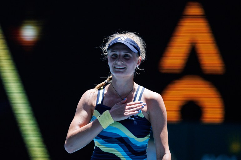 Ukraine's Dayana Yastremska at the Australian Open. She is patting her chest and smiling.