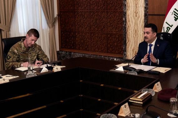 Iraqi Prime Minister Mohammed Shia al Sudani and Major General Joel "J.B." Vowell
