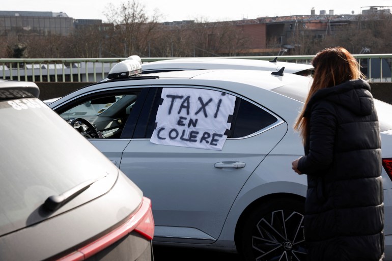 A sign reading "Angry taxi"