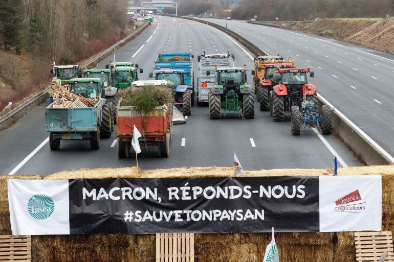A banner reads "Macron answer us"