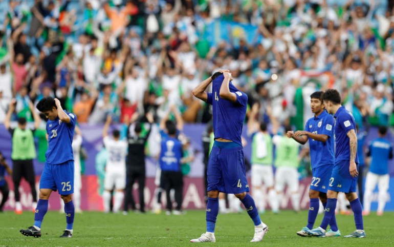 Soccer Football - AFC Asian Cup - Round of 16 - Uzbekistan v Thailand - Al Janoub Stadium, Al Wakrah, Qatar - January 30, 2024 Thailand's Elias Dolah looks dejected after the match REUTERS/Thaier Al-Sudani