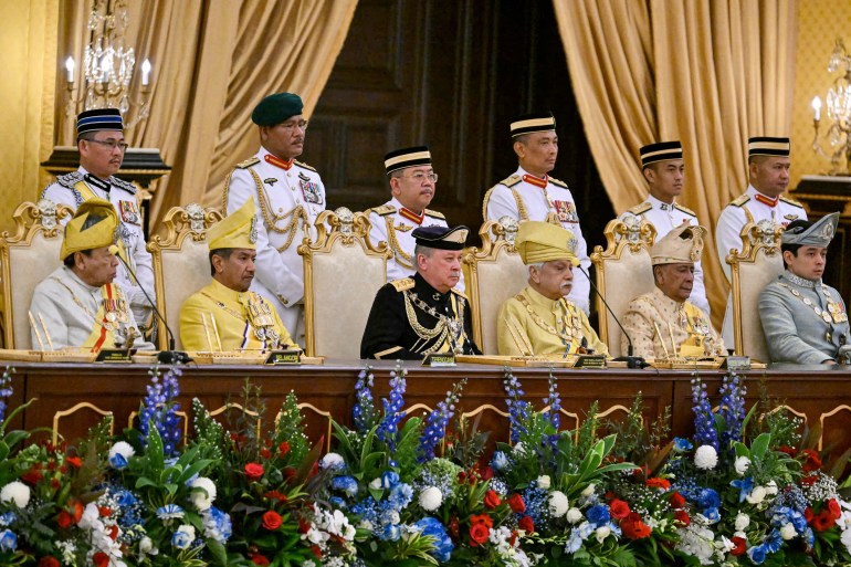 Sultan Ibrahim (n black) during the oath taking ceremony. 