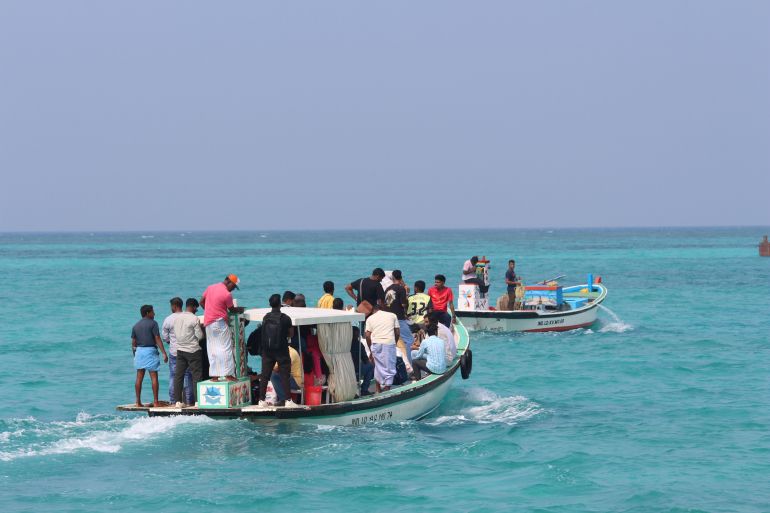 Fisherfolk on boats in Lakshadweep, which is caught in a diplomatic tiff