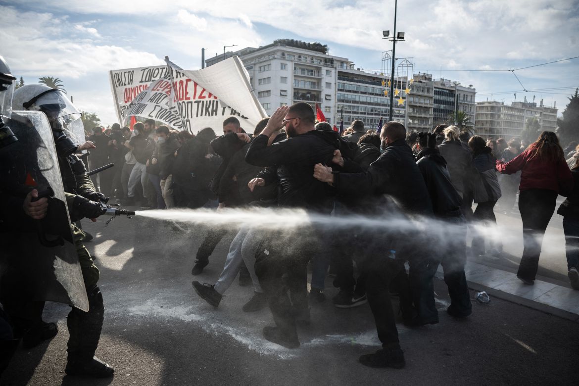 Students clash with riot police in front of the Greek Parliament during a demonstration against the government's plans for private universities, in Athens