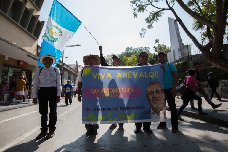 Arevalo supporters march in Guatemala City on January 14, 2024 [Jeff Abbott/Al Jazeera]