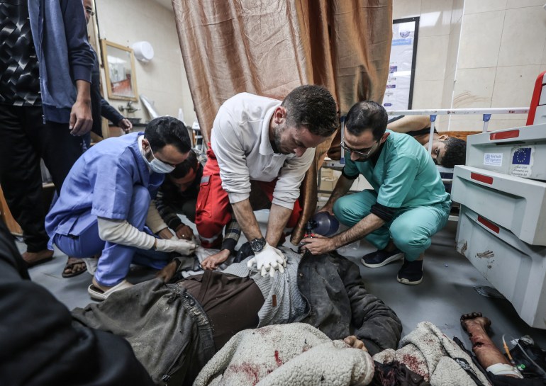 Doctors provide first aid to Palestinian people, including children, injured as a result of Israeli attack and brought to the Al-Aqsa Martyrs Hospital in Deir al Balah, Gaza on January 06, 2024.
