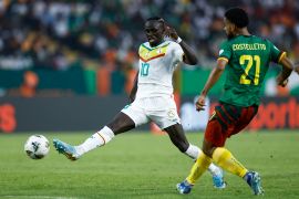 Senegal's Sadio Mane fights for the ball with Cameroon's Jean Charles Castelletto
