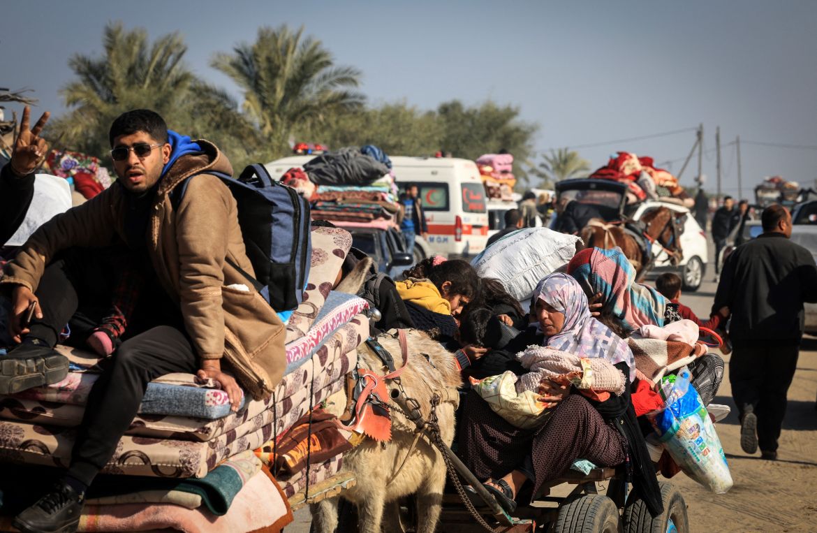 Palestinian families fleeing the city on the coastal road leading to Rafah