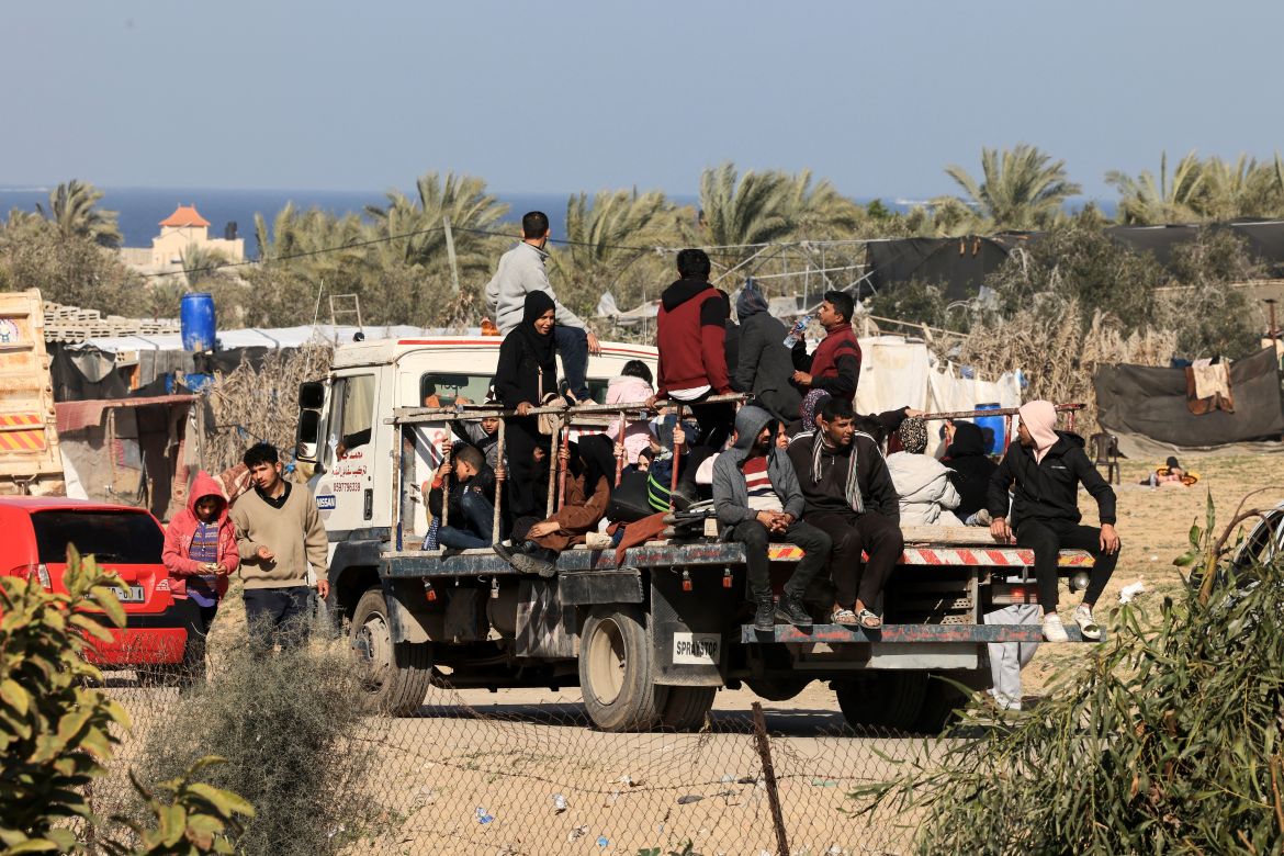 Palestinian families fleeing the city on the coastal road leading to Rafah