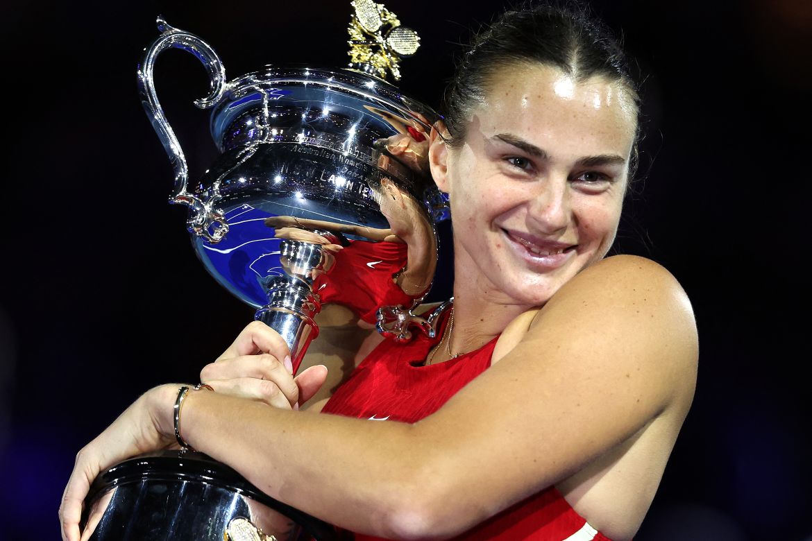 Belarus' Aryna Sabalenka celebrates with the Daphne Akhurst Memorial Cup after defeating China's Zheng Qinwen during their women's singles final match on day 14 of the Australian Open tennis tournament in Melbourne on January 27