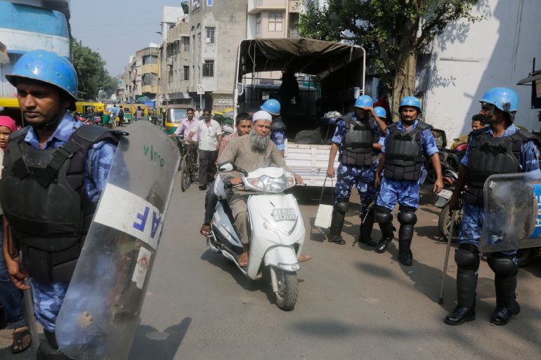 Rapid Action Force (RAF) soldiers keep guard in Ahmadabad, India, Saturday, Nov. 9, 2019. India's Supreme Court has ruled in favor of a Hindu temple on a disputed religious ground and ordered that alternative land be given to Muslims. The dispute over land ownership has been one of the country's most contentious issues. (AP Photo/Ajit Solanki)