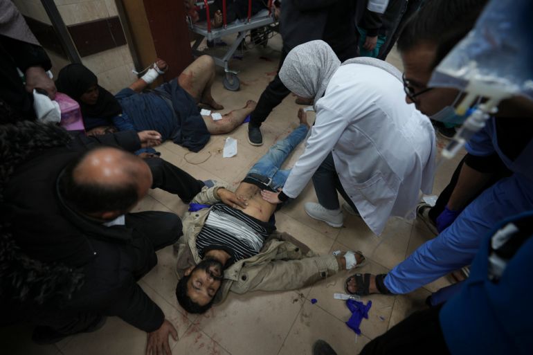 Patients being treated on the flor in the Al-Aqsa Hospital in Gaza
