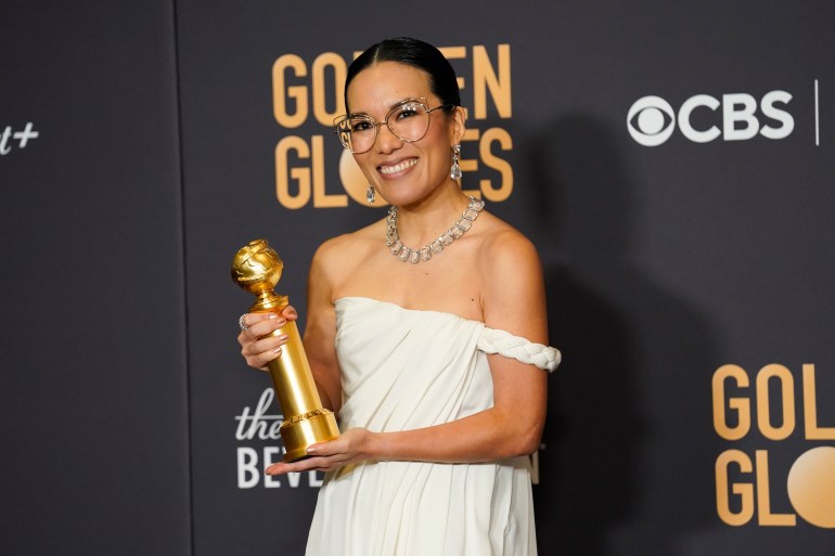 Ali Wong poses in the press room with the award for best performance by an actress in a limited series, anthology series, or a motion picture made for television for "Beef" at the 81st Golden Globe Awards on Sunday, 