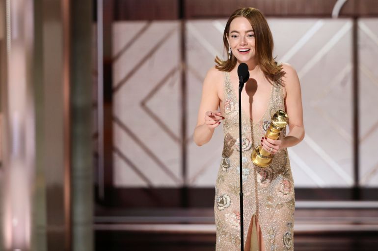 Emma Stone accepting the award for best female actor in a motion picture for her role in "Poor Things" during the 81st Annual Golden Globe Awards 