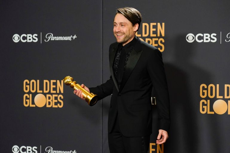 Kieran Culkin poses in the press room with the award for best performance by an actor in a television series, drama for "Succession" at the 81st Golden Globe Awards