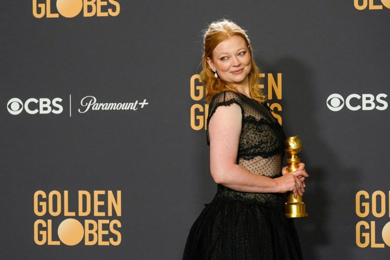 Sarah Snook poses in the press room with the award for best performance by an actress in a television series, drama for "Succession" at the 81st Golden Globe Awards on Sunday, 