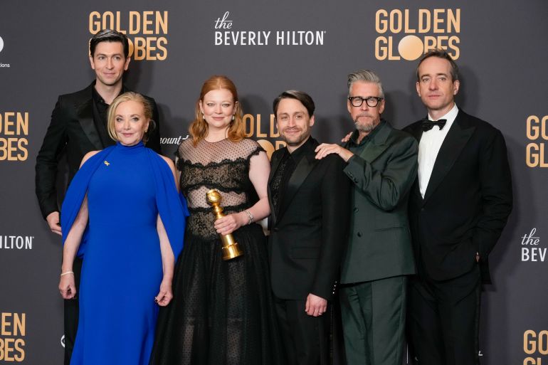 Nicholas Braun, from left, J. Smith-Cameron, Sarah Snook, Kieran Culkin, Alan Ruck, and Matthew Macfayden pose in the press room in the press room with the award for best television series, drama for "Succession" at the 81st Golden Globe Awards on Sunday