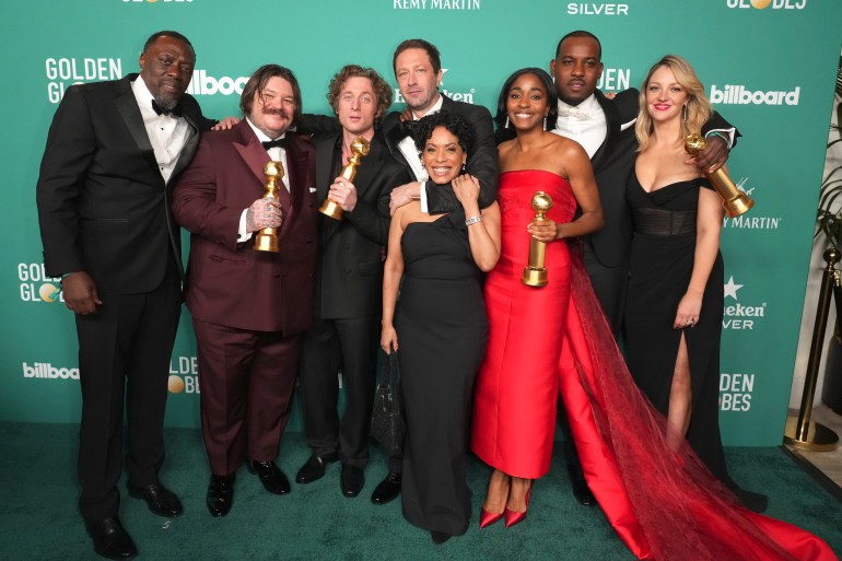 Edwin Lee Gibson, from left, Matty Matheson, Jeremy Allen White, Ebon Moss-Bachrach, Liza Colon-Zayas, AyoEdebiri, Lionel Boyce, and Abby Elliott, winners of the award for best television series, musical or comedy for "The Bear" arrive at the 81st Golden Globe Awards Billboard after party on Sunday.
