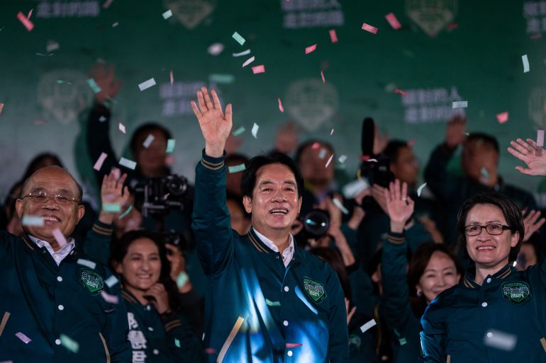 Taiwanese Vice President Lai Ching-te, also known as William Lai, left, celebrates his victory with running mate Bi-khim Hsiao in Taipei, Taiwan, Saturday, Jan. 13