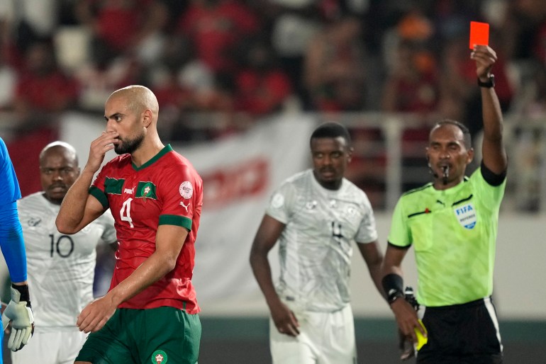 Morocco's Sofyan Amrabat walks off the pitch after receiving a red card