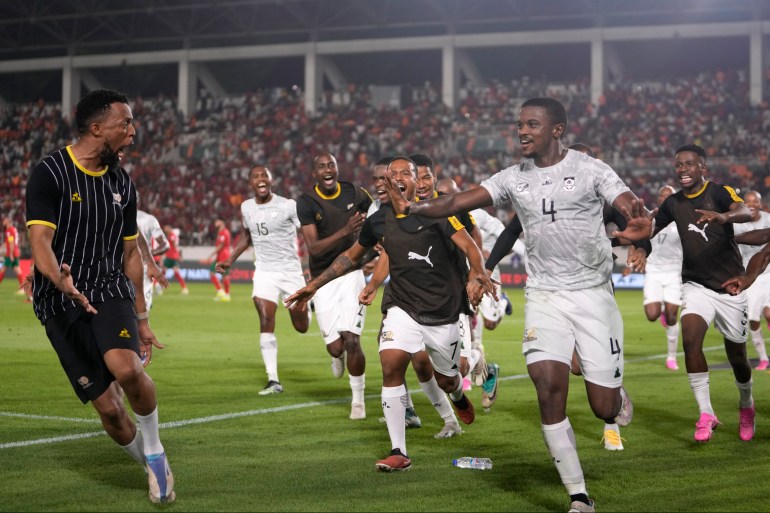 South Africa's Teboho Mokoena, right, celebrates with teammates after scoring his side's second goal 