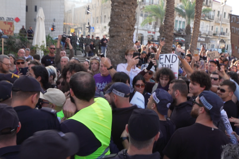 Protesters gather at the first anti-war protest in Israel since October 7 [Alasdair Brenard/Al Jazeera]