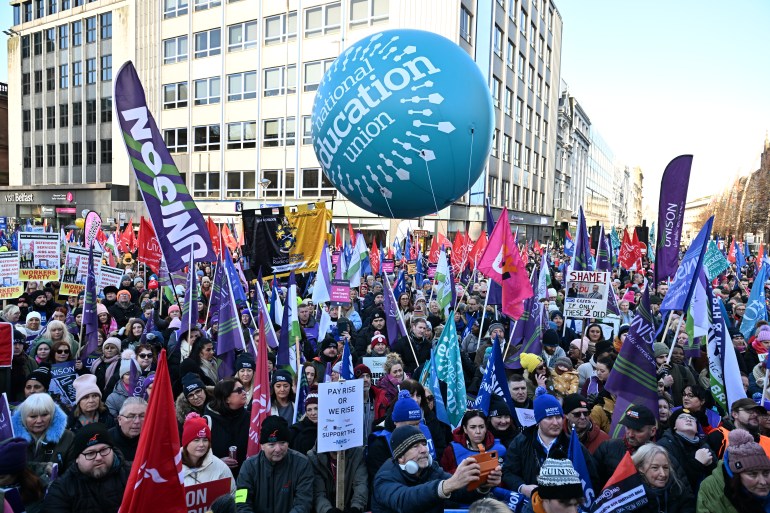 Public sector workers march in protest on January 18, 2024 in Belfast, Northern Ireland.