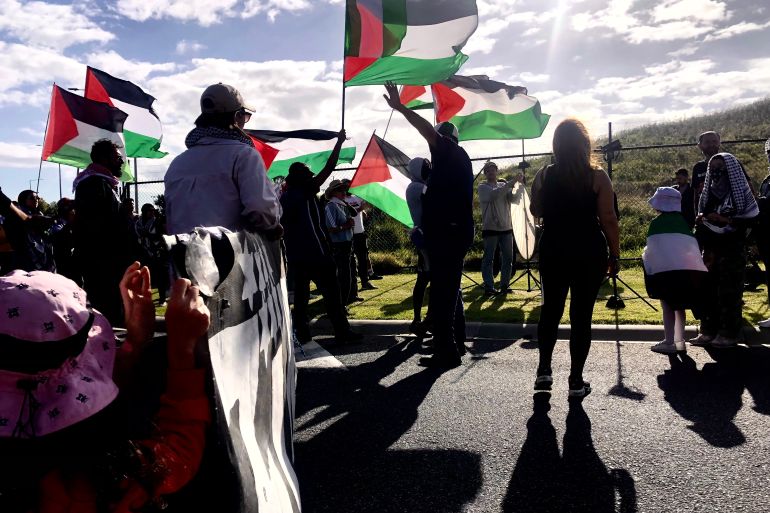 Protesters waving Palestinian flags in Melbourne