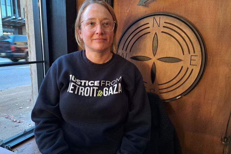 Dana Kornberg, in a black sweater that reads: "Justice from Detroit to Gaza".