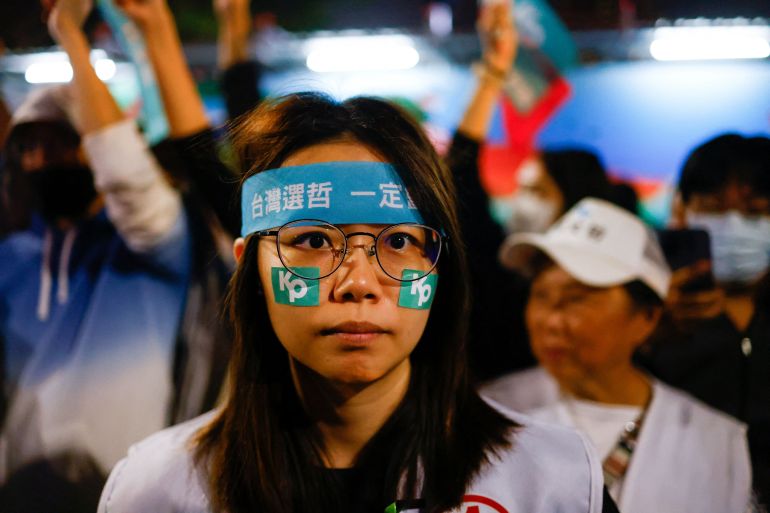 A supporters of Ko Wen-je and the Taiwan People's Party where stickers with his "kp" logo. REUTERS/ANN WANG
