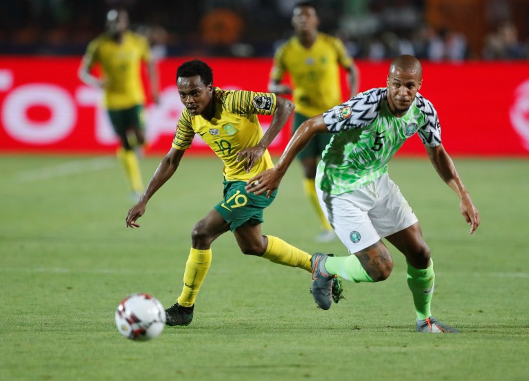 South Africa's Percy Tau in action with Nigeria's William Troost-Ekong