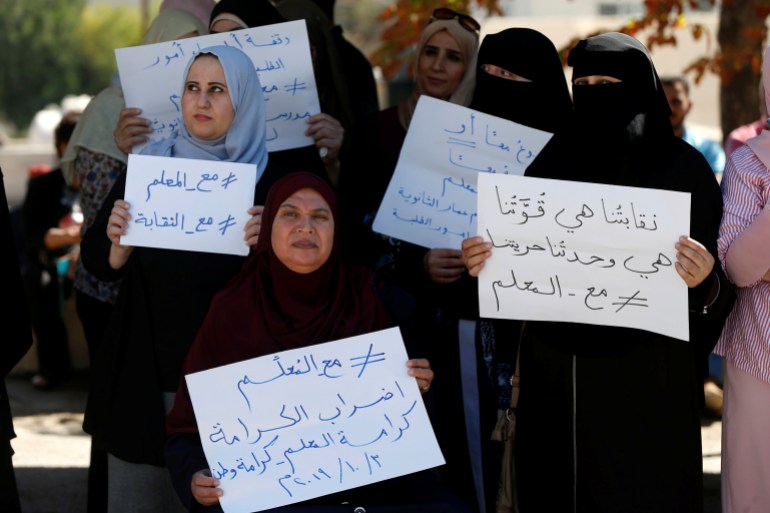 Public schools' teachers take part in a protest as part of their strike in Amman,