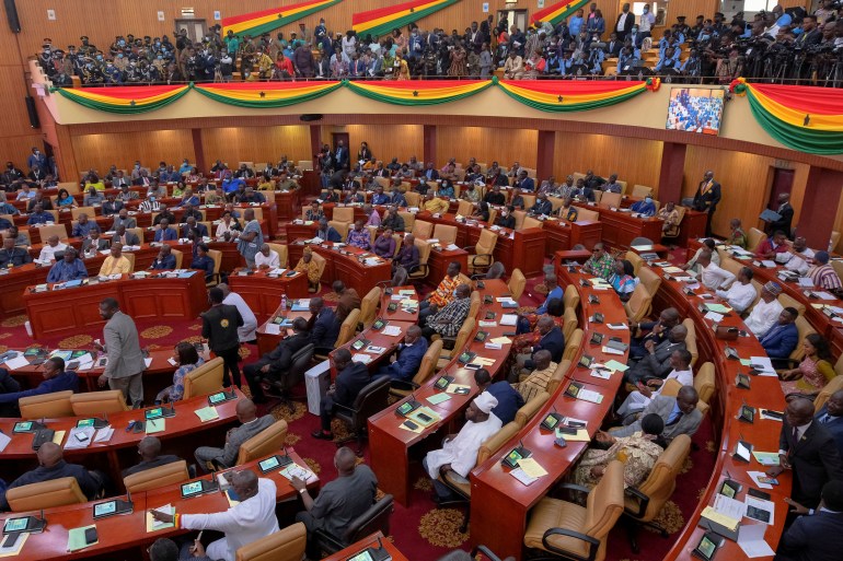 Parliamentarians and members of the public listen as Ghanaian President Nana Akufo-Addo delivers his annual state of the nation address to the parliament in Accra, Ghana