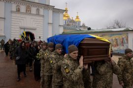 Soldiers carry the coffin of Ukrainian poet and serviceman Maksym Kryvtsov, who was killed in action fighting against Russia&rsquo;s attack on Ukraine, during his funeral ceremony at St. Michael&#039;s Monastery in Kyiv, January 11, 2024 [File: Thomas Peter/Reuters]