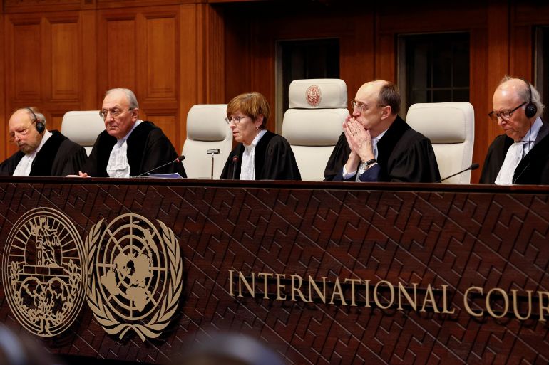 ICJ judges sit behind podium