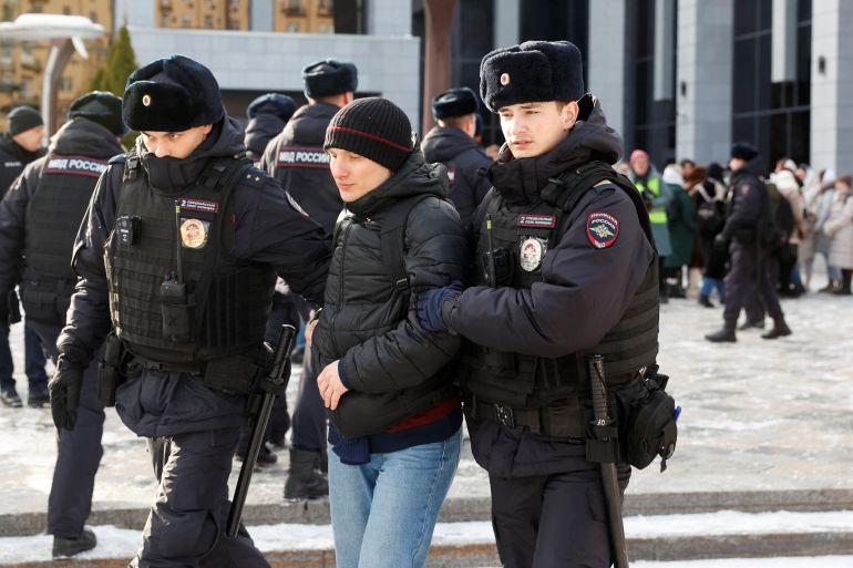 Police officers detain a person during a gathering of the "Way Home" group's members, who demand the return of their mobilised relatives involved in the Russian armed forces' military campaign in Ukraine, in central Moscow, Russia, February 3, 2024. REUTERS/Stringer